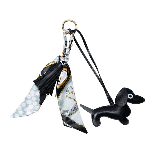 Black padded sausage dog keyring with faux leather tassel and equestrian-themed satin scarf, available in several colours