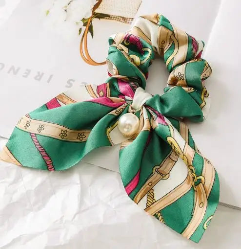 Ippico Equestrian Scrunchie in green, crafted from high-grade satin print fabric with pink and beige accents, featuring a sparkling pearl embellishment.