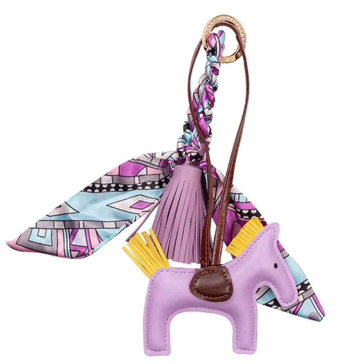 Adorable Ippico DELUXE Pony Keyring in Lilac with padded faux leather tassel and satin equestrian-themed scarf. Ideal for keys, bags, or as a charming gift. Also available in Navy, Yellow, Pink, Cyan, and Red