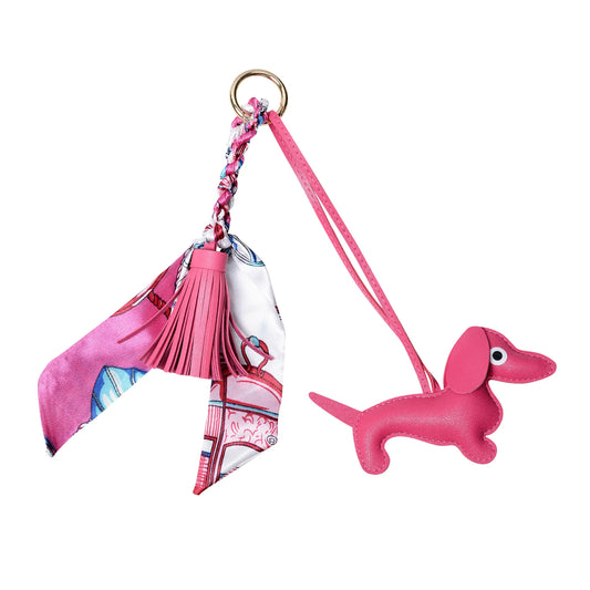 Pink padded sausage dog keyring with faux leather tassel and equestrian-themed satin scarf, available in several colours