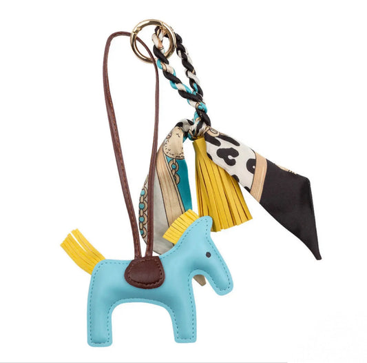 Adorable Ippico DELUXE Pony Keyring in cyan blue with padded faux leather tassel and satin equestrian-themed scarf. Ideal for keys, bags, or as a charming gift. Also available in Navy, Yellow, Pink, Purple, and Red